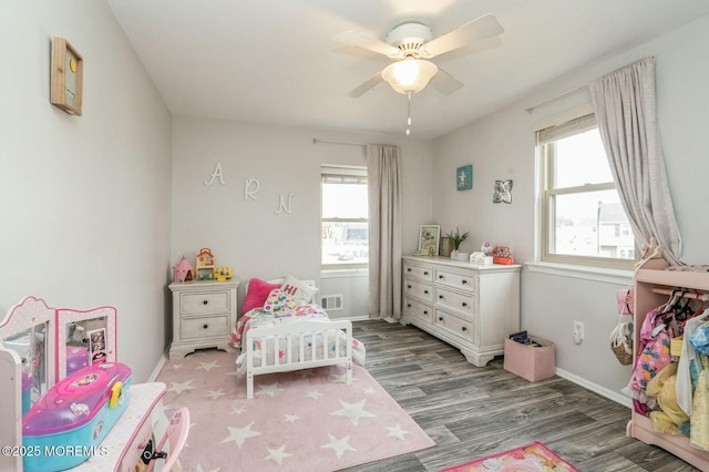 bedroom with hardwood / wood-style floors and ceiling fan