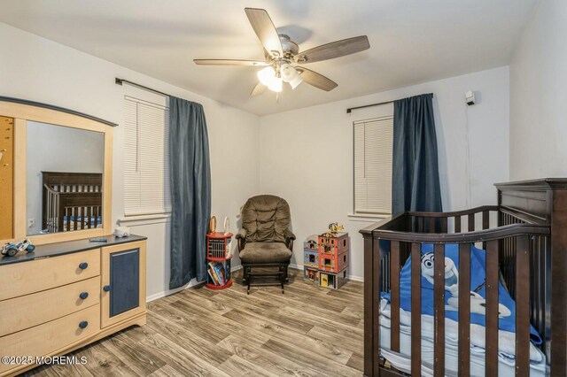 bedroom with hardwood / wood-style flooring and ceiling fan