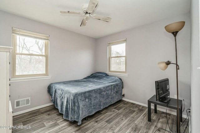 bedroom with wood-type flooring and ceiling fan