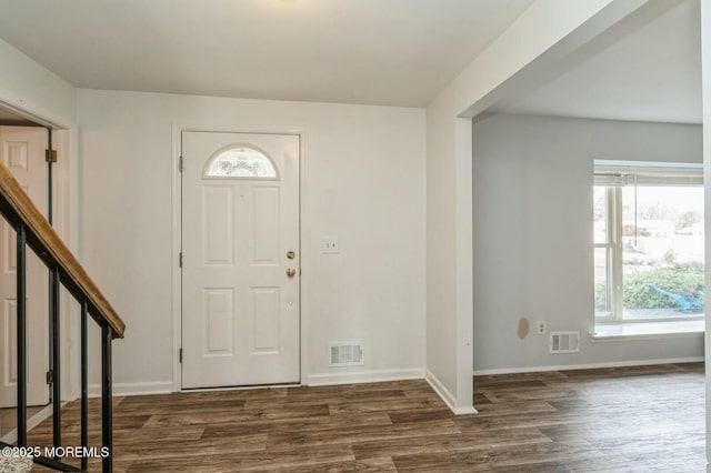 entrance foyer with dark hardwood / wood-style floors