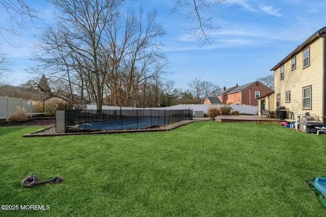 view of yard with a pool and cooling unit