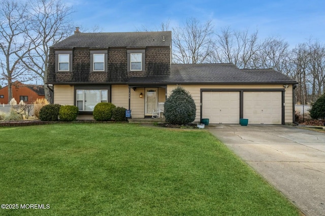 view of front of house with a garage and a front yard