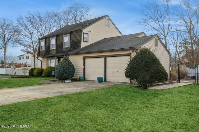 view of side of property featuring a yard and a garage