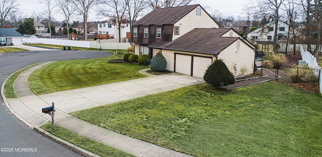 view of home's exterior featuring a garage and a lawn