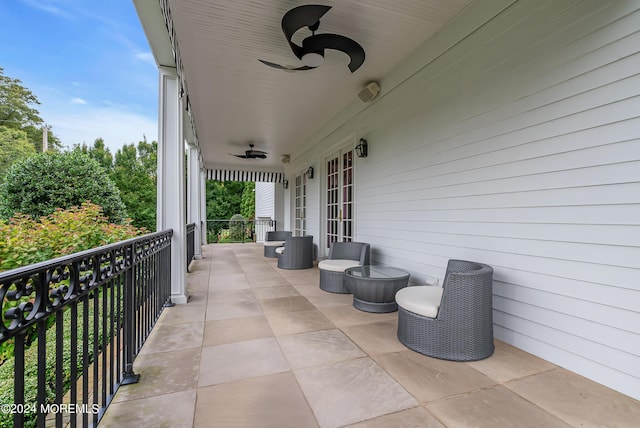 view of patio featuring ceiling fan