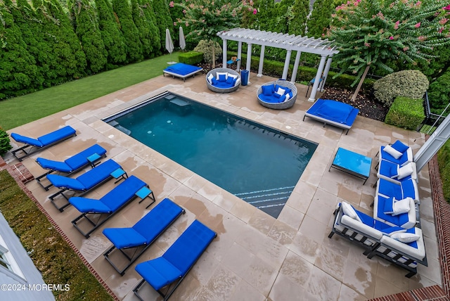 view of pool with an outdoor hangout area, a pergola, and a patio area