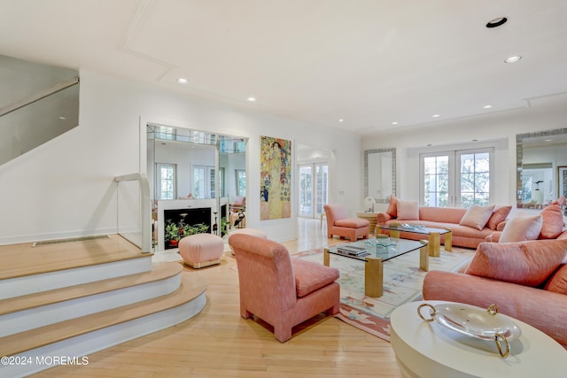 living room with light hardwood / wood-style floors and french doors