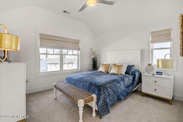 carpeted bedroom featuring lofted ceiling and ceiling fan