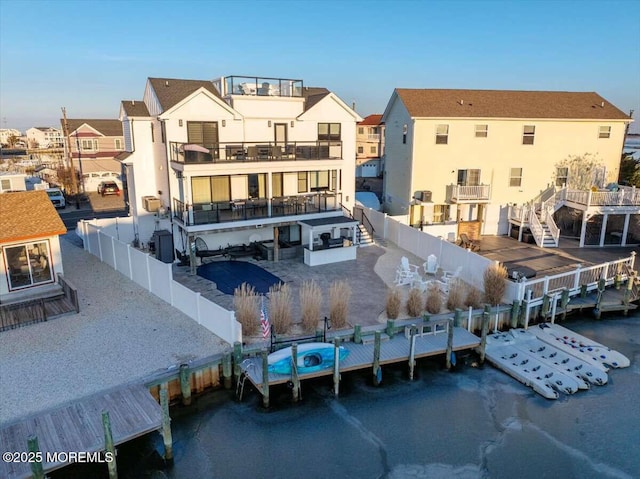 rear view of house with a water view