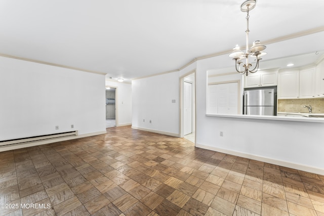 unfurnished living room featuring a baseboard heating unit, dark parquet flooring, ornamental molding, and a chandelier