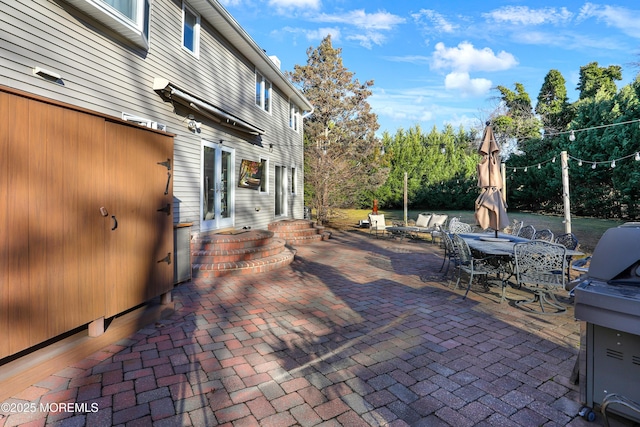 view of patio featuring a grill