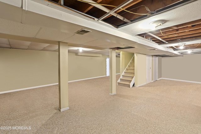 basement with light colored carpet