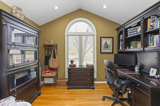 office space with lofted ceiling and light hardwood / wood-style floors