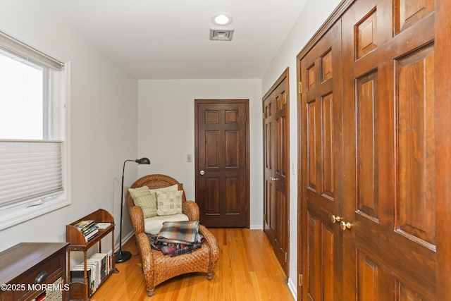 living area featuring light hardwood / wood-style floors