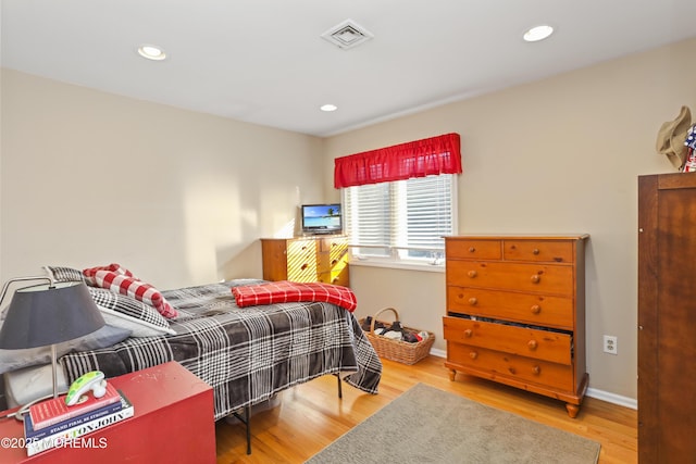 bedroom with light hardwood / wood-style floors