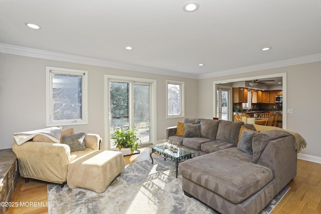 living room featuring hardwood / wood-style flooring and ornamental molding