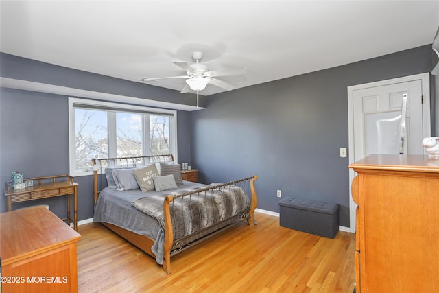 bedroom with ceiling fan and light wood-type flooring