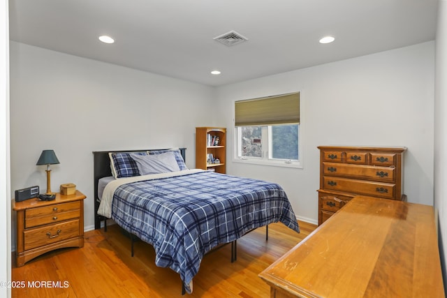 bedroom featuring hardwood / wood-style floors