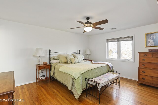 bedroom featuring hardwood / wood-style flooring and ceiling fan