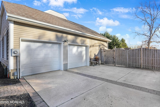 view of side of home featuring a garage