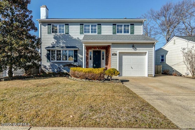 view of front of property with a garage and a front yard