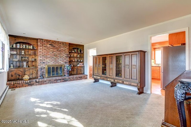 unfurnished living room featuring ornamental molding, carpet floors, built in features, and a fireplace