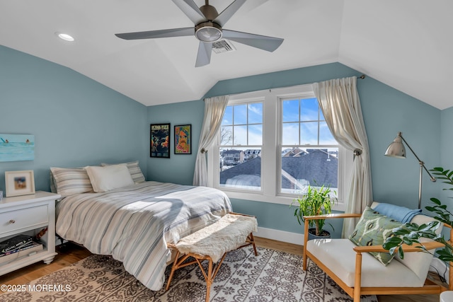 bedroom featuring lofted ceiling, ceiling fan, and light wood-type flooring