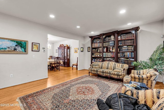 living area featuring baseboards, recessed lighting, and wood finished floors