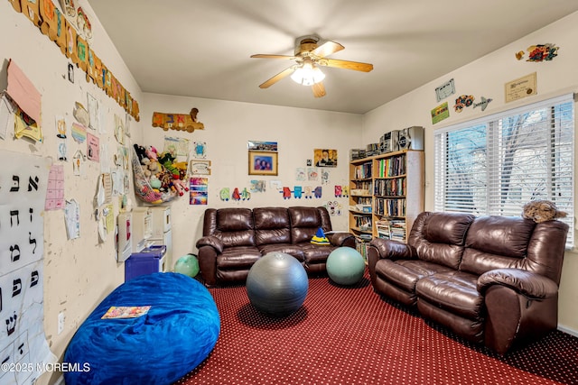 interior space with ceiling fan