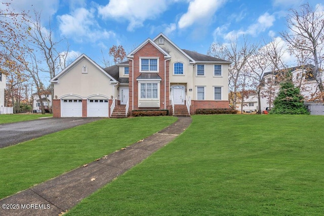 view of front of home with a garage and a front yard