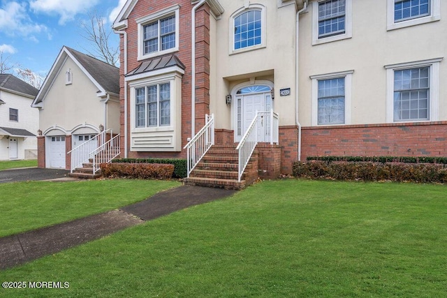 view of front of property featuring a garage and a front yard