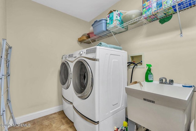 laundry area featuring sink and independent washer and dryer