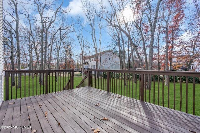 wooden deck with a lawn