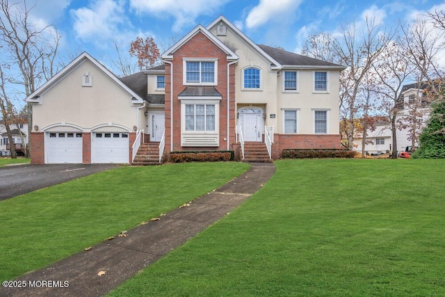 view of front of home featuring a garage and a front lawn