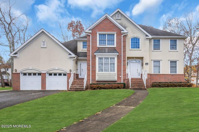 view of front of property featuring a garage and a front lawn