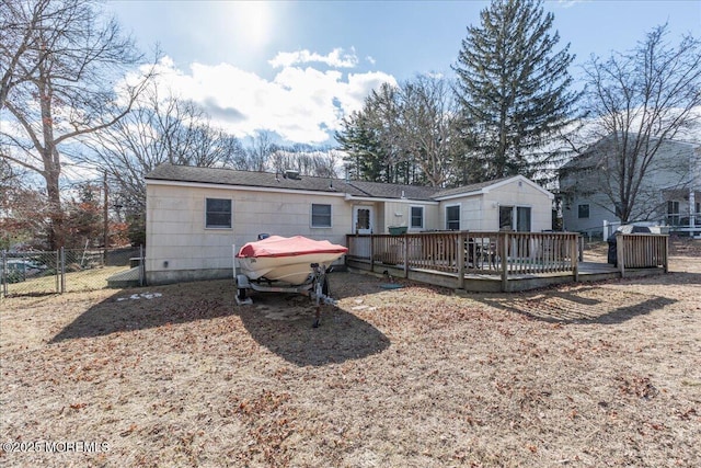 back of property with a wooden deck