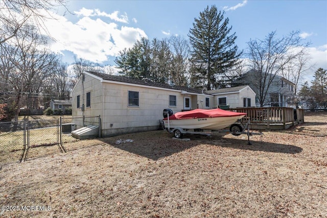 back of property featuring a deck