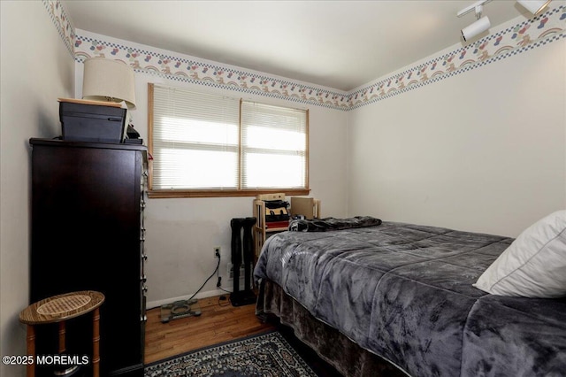 bedroom featuring dark hardwood / wood-style floors