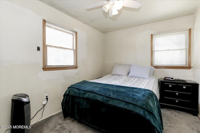 bedroom featuring light carpet and ceiling fan