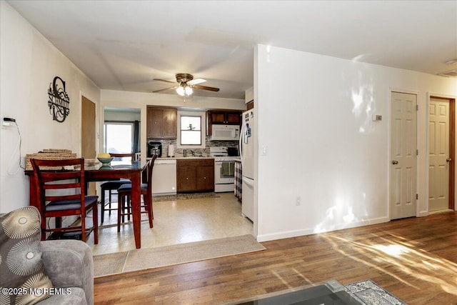 dining room featuring ceiling fan and light hardwood / wood-style floors