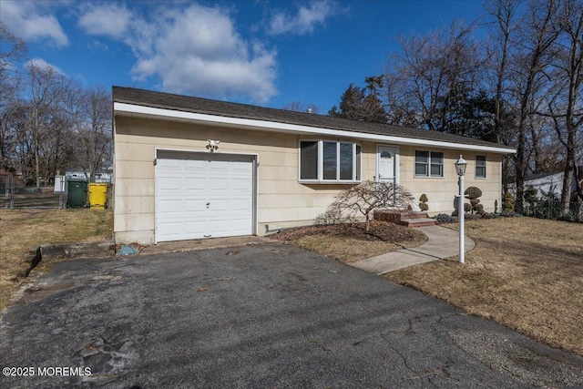 ranch-style home with a garage