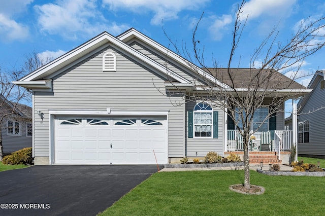 ranch-style home with a porch, a front yard, driveway, and an attached garage