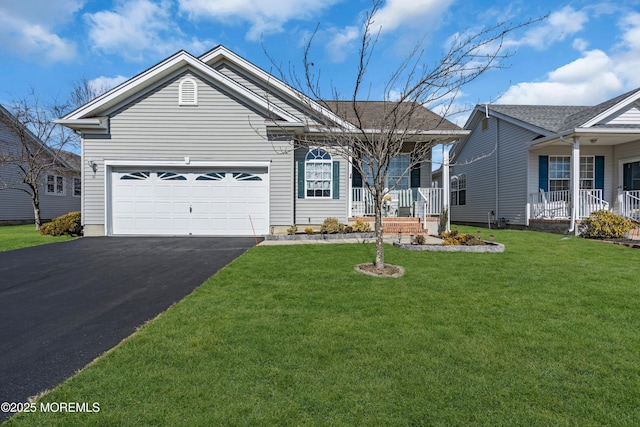 ranch-style house featuring covered porch, driveway, a front yard, and a garage