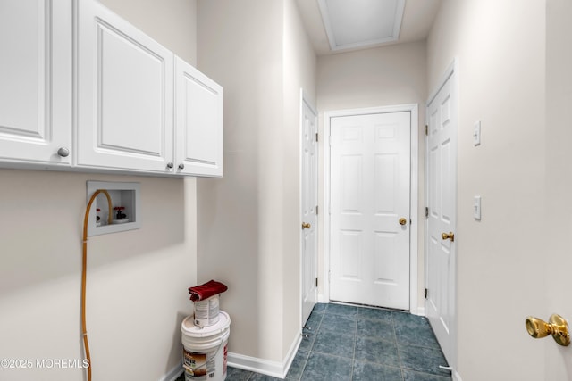 doorway featuring baseboards