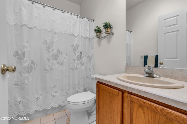 full bathroom featuring a shower with curtain, vanity, toilet, and tile patterned floors