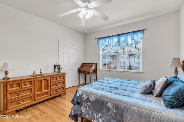 bedroom featuring ceiling fan and light wood-style flooring