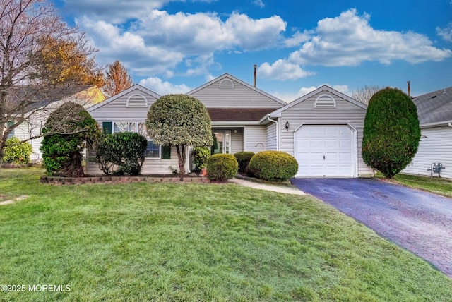 single story home featuring a garage and a front yard