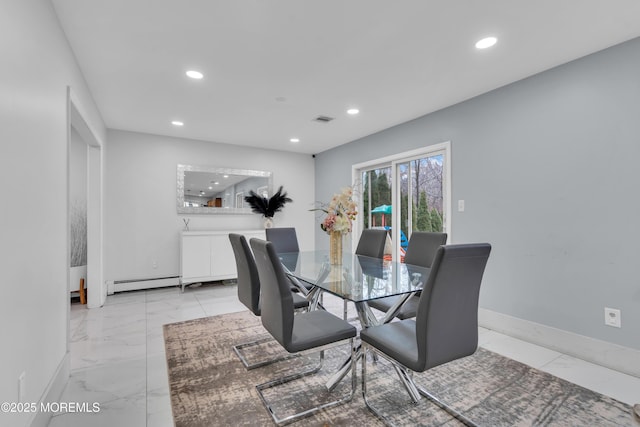 dining space with a baseboard radiator