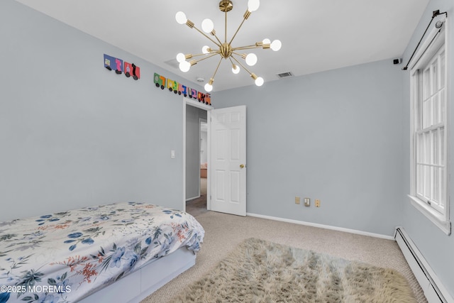 carpeted bedroom with a baseboard radiator and a notable chandelier