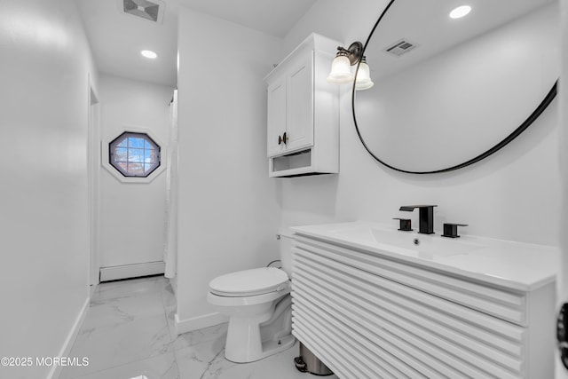 bathroom with vanity, a baseboard heating unit, and toilet